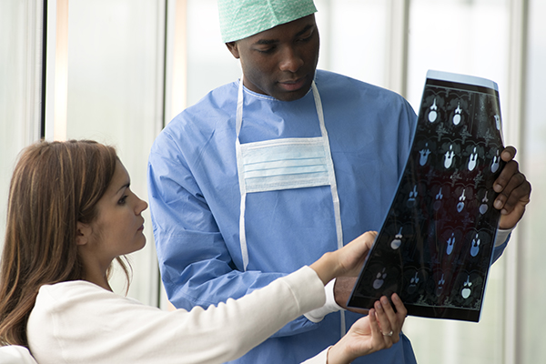 doctor looking at patients xray