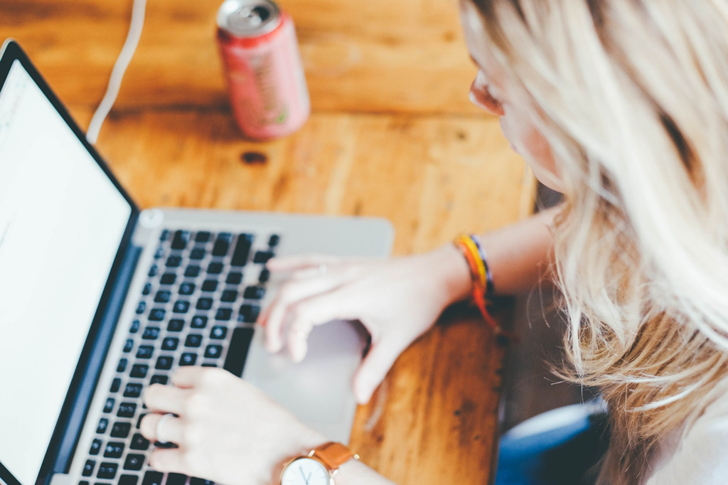 woman typing on laptop