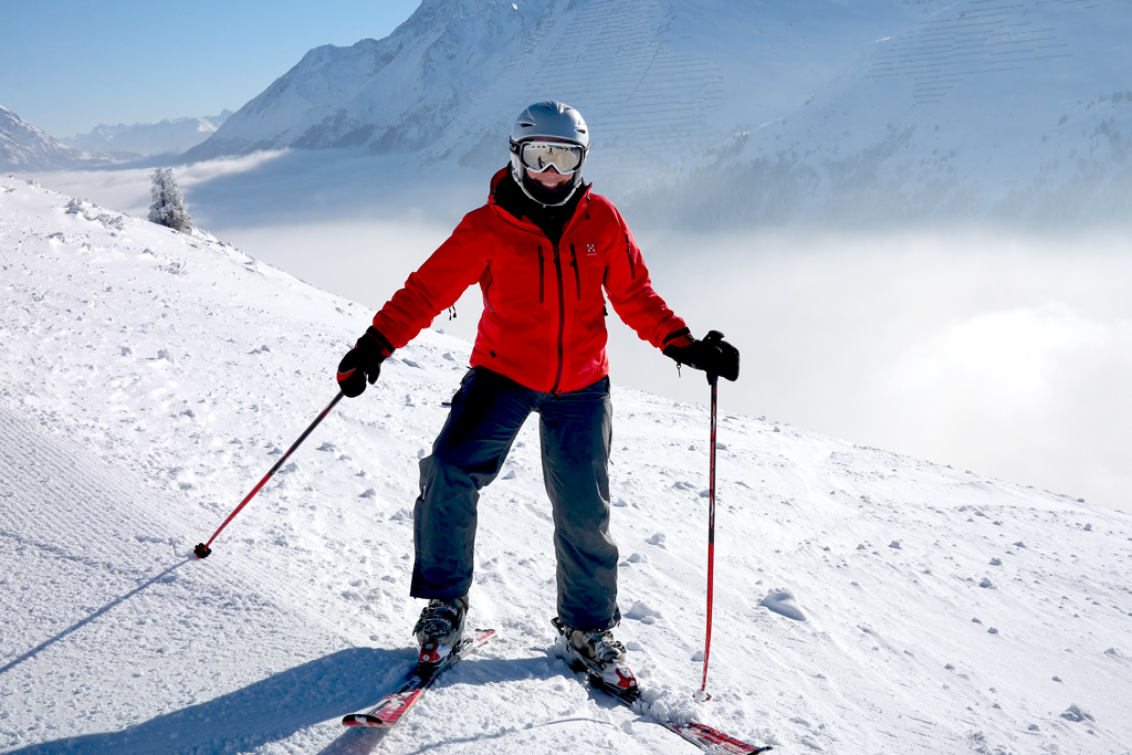 woman posing for photo while skiing