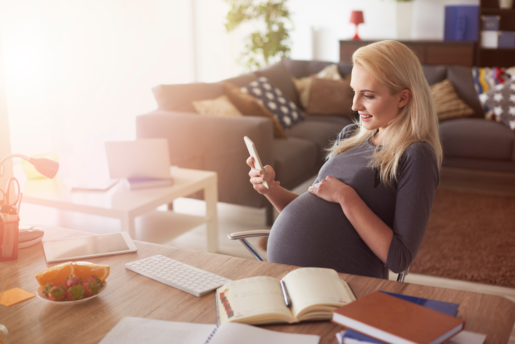 pregnant woman working at desk