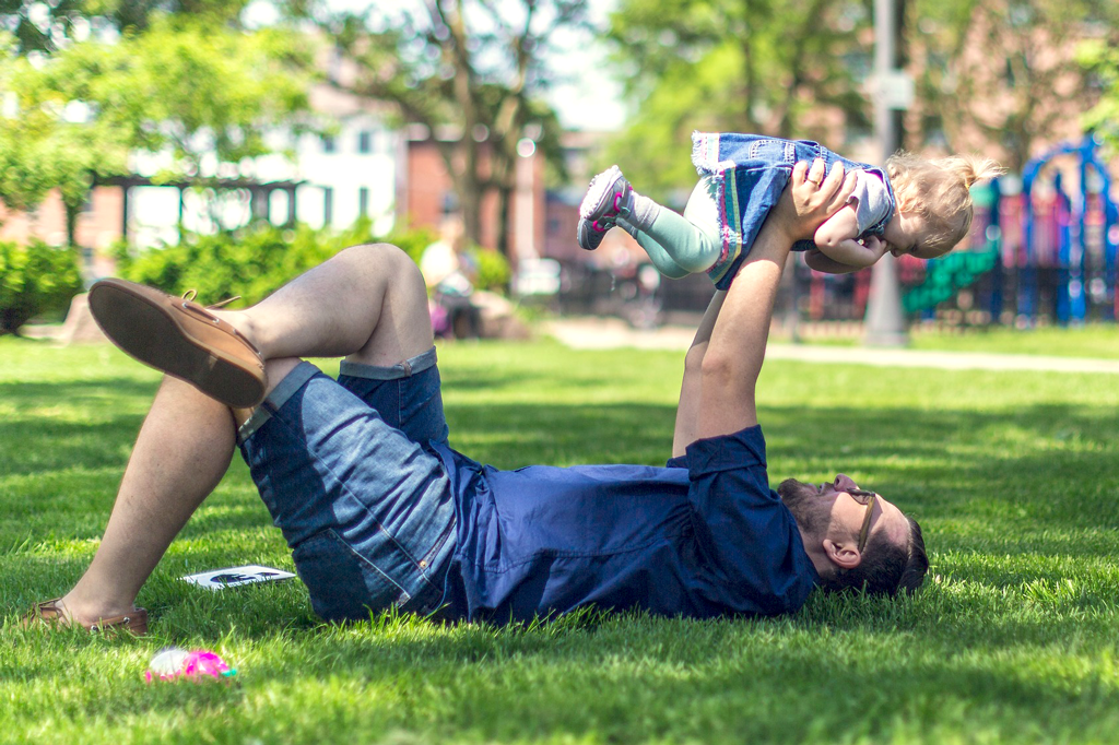 Father playing with his child in the park