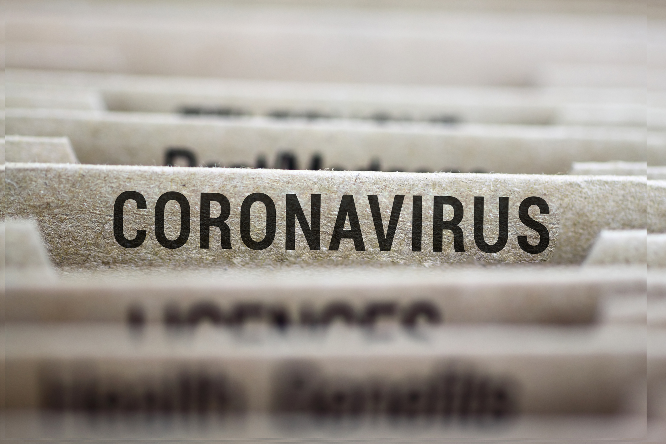 Filing cabinet closeup image with a file named Coronavirus