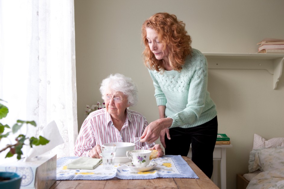 Woman taking care of elderly family member