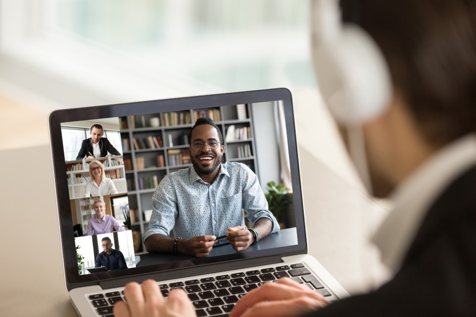 Man connecting with coworkers during remote work