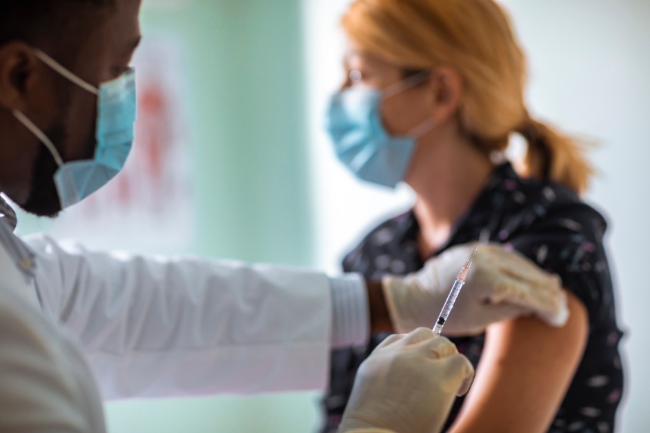 Woman receiving COVID-19 vaccine.