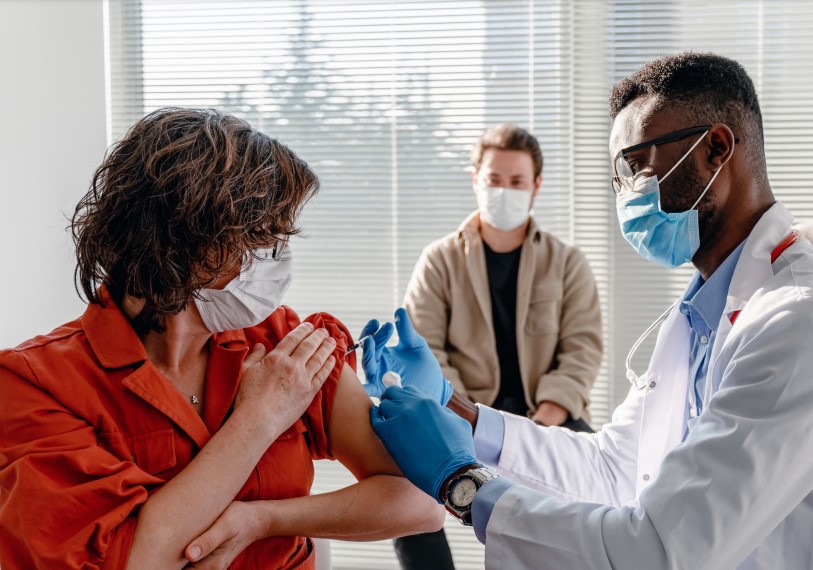 Woman receiving COVID-19 vaccine