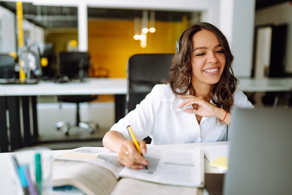 Woman completing form while sitting at her computer
