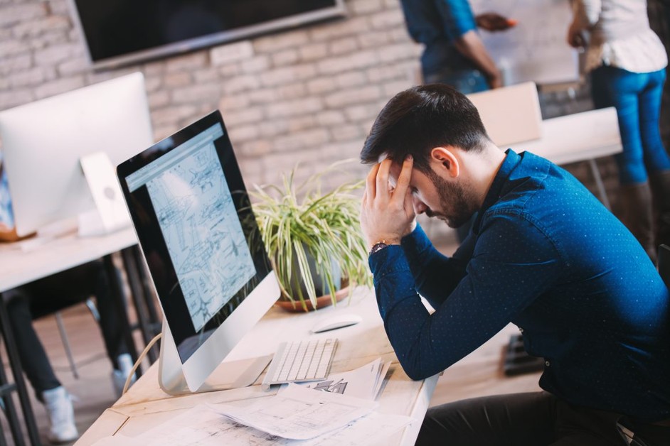 Employee stressed at their desk