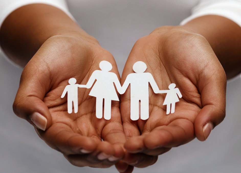 Hands holding a family