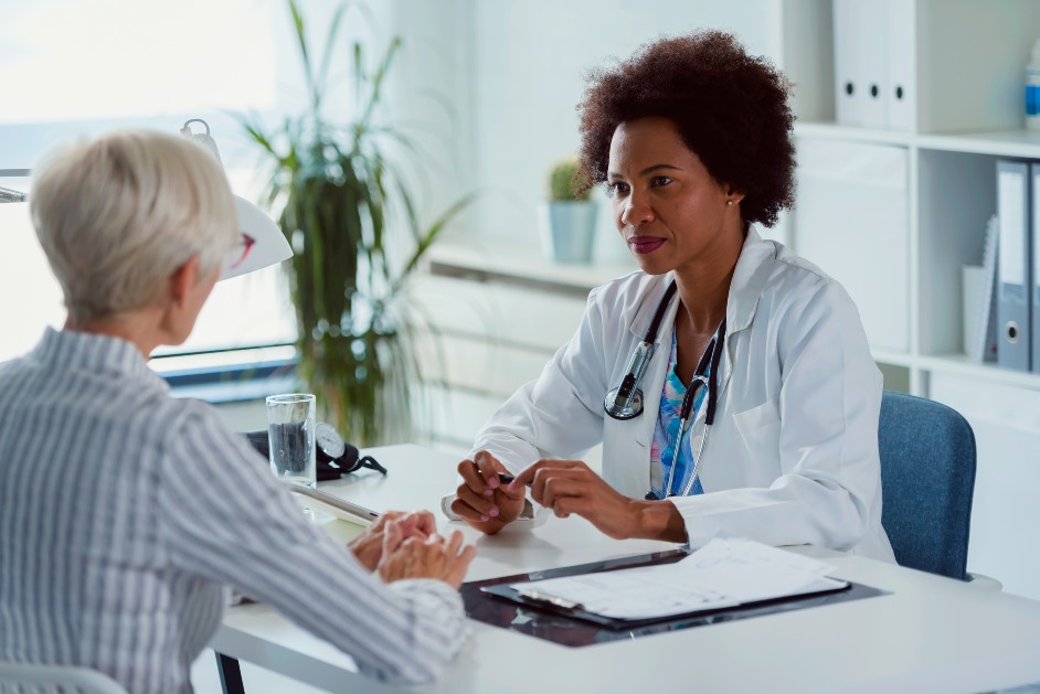 Woman speaking with physician