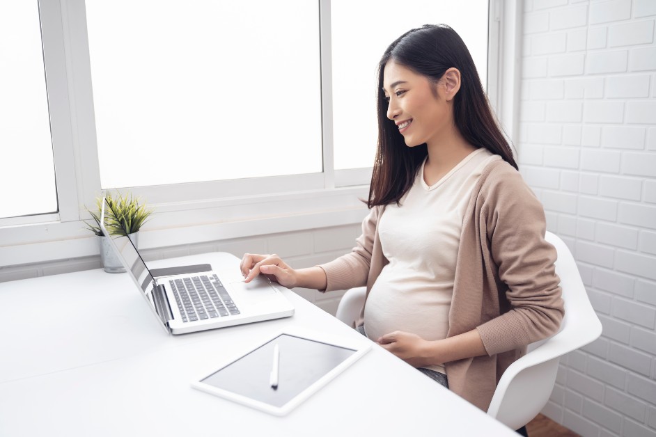 Pregnant woman working at her desk